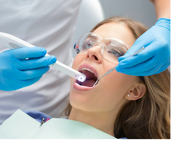 Stock image of a girl been checking her teeth by dentist